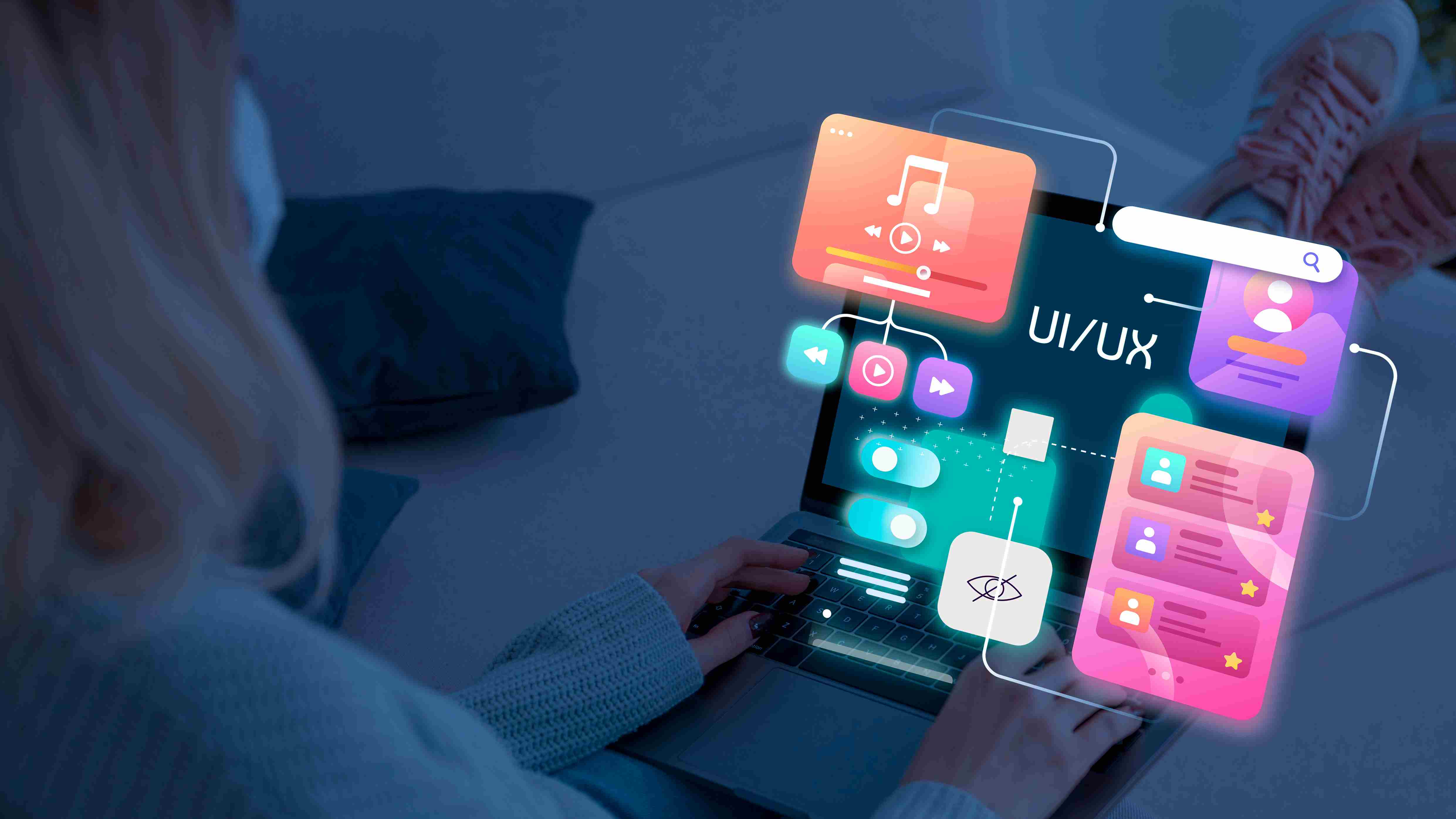 UI/UX designer working on laptop with web app interface elements for web application
development services